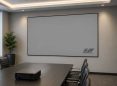 Large white projector screen in modern conference room.