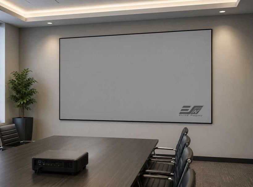 Large white projector screen in modern conference room.